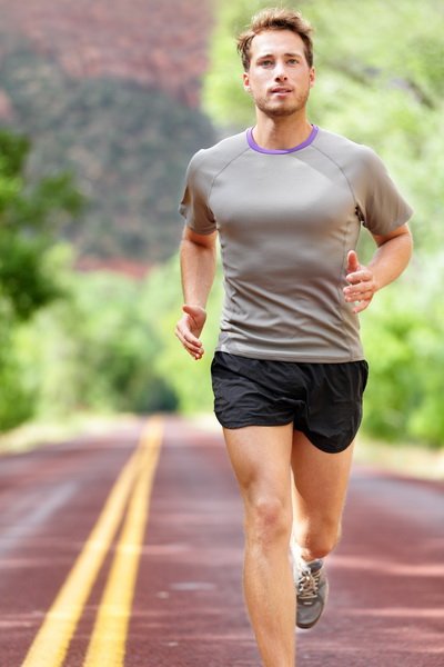 Man running on road - Sport and fitness runner